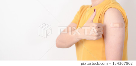 Adult Woman with bandage after received vaccine. Vaccination and Immunization for Influenza, HPV, Zoster, IPD, DTP or Diphtheria, Tetanus and Pertussis, MMR, Hepatitis B, Covid and Varicella vaccine Adult Woman with bandage after received vaccine. Vaccination and Immunization for Influenza, HPV, Zoster, IPD, DTP or Diphtheria, Tetanus and Pertussis, MMR, Hepatitis B, Covid and Varicella vaccine 134367802