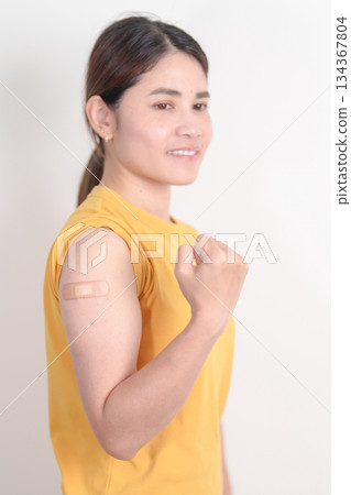 Adult Woman with bandage after received vaccine. Vaccination and Immunization for Influenza, HPV, Zoster, IPD, DTP or Diphtheria, Tetanus and Pertussis, MMR, Hepatitis B, Covid and Varicella vaccine Adult Woman with bandage after received vaccine. Vaccination and Immunization for Influenza, HPV, Zoster, IPD, DTP or Diphtheria, Tetanus and Pertussis, MMR, Hepatitis B, Covid and Varicella vaccine 134367804