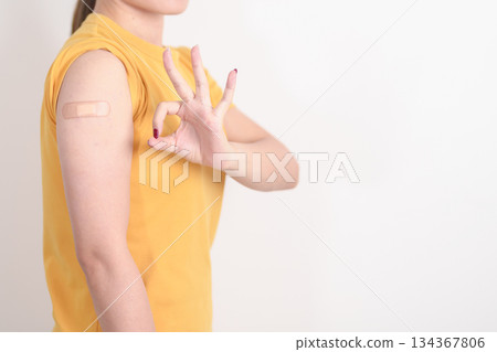 Adult Woman with bandage after received vaccine. Vaccination and Immunization for Influenza, HPV, Zoster, IPD, DTP or Diphtheria, Tetanus and Pertussis, MMR, Hepatitis B, Covid and Varicella vaccine Adult Woman with bandage after received vaccine. Vaccination and Immunization for Influenza, HPV, Zoster, IPD, DTP or Diphtheria, Tetanus and Pertussis, MMR, Hepatitis B, Covid and Varicella vaccine 134367806