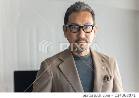 A male designer with a calm expression A male designer with a calm expression 134368071