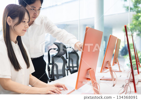 Young men and women working in the office 134368091