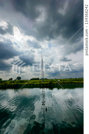 Symmetrical coastal view emphasizing mood and atmospheric elements Symmetrical coastal view emphasizing mood and atmospheric elements 134368242