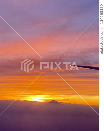 Orange sunset sky gradient background seen from an airplane 134368320