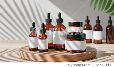 Cosmetic bottle mockup group on wooden podium with palm shadow and blurred bottles background amber glass skincare product packaging display Cosmetic bottle mockup group on wooden podium with palm shadow and blurred bottles background amber glass skincare product packaging display 134369114