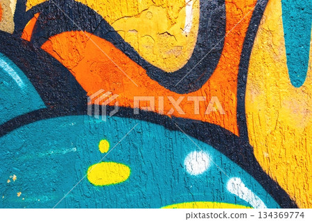 Bold Street Art Graffiti with Turquoise, Orange, Yellow Accents Reflecting Urban 90s Aesthetics Bold Street Art Graffiti with Turquoise, Orange, Yellow Accents Reflecting Urban 90s Aesthetics 134369774