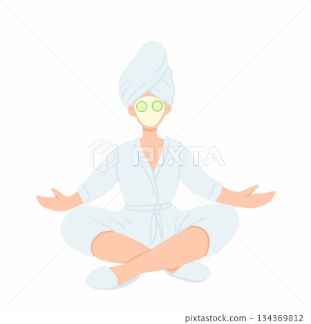 Woman in bathrobe, towel and face mask meditating in lotus pose. Home spa relaxing with cucmber slices on eyes. Woman in bathrobe, towel and face mask meditating in lotus pose. Home spa relaxing with cucmber slices on eyes. 134369812