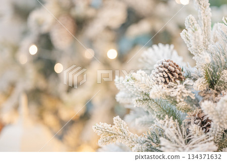 Christmas tree decorated with snowflakes and pine cones, close up Christmas tree decorated with snowflakes and pine cones, close up 134371632