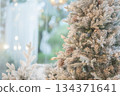 Christmas tree decorated with snowflakes and pine cones, close up 134371641