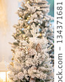 Christmas tree with pine cones covered with hoarfrost 134371681