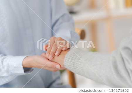 Women holding hands Women holding hands 134371892