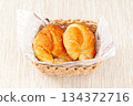 Croissants in a basket 134372716