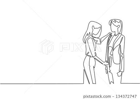 Continuous line drawing illustrates a female tailor fitting a jacket on a woman client, symbolizing fashion concept and craftsmanship for National Tailors Day with focus on custom apparel design. Continuous line drawing illustrates a female tailor fitting a jacket on a woman client, symbolizing fashion concept and craftsmanship for National Tailors Day with focus on custom apparel design. 134372747