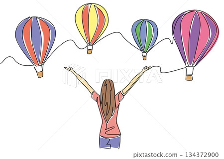 Continuous line drawing of woman raising hands to colorful hot air balloons celebrates freedom and travel concept for Hot Air Balloon Day, symbolizing joy, adventure, and international exploration. 134372900