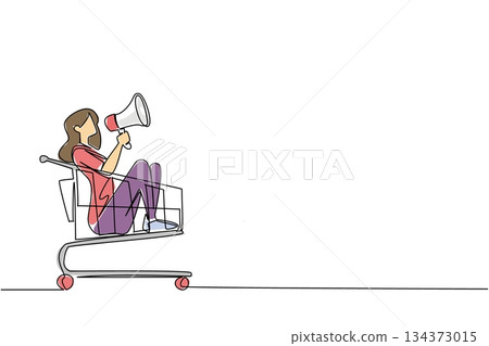 A woman with megaphone sits inside a shopping cart in continuous line drawing style, representing consumer marketing voice, retail promotion, and honoring Shopping Cart Day worldwide. 134373015