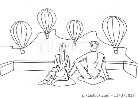 Single line drawing of a couple sitting and watching hot air balloons expresses love and travel concept within Hot Air Balloon Day, celebrating romance, freedom, and scenic international adventures. 134373027
