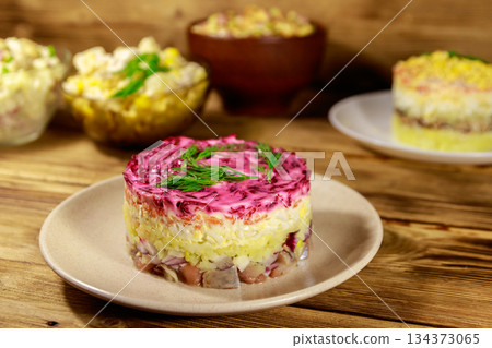 Set of festive mayonnaise salads on wooden table Set of festive mayonnaise salads on wooden table 134373065
