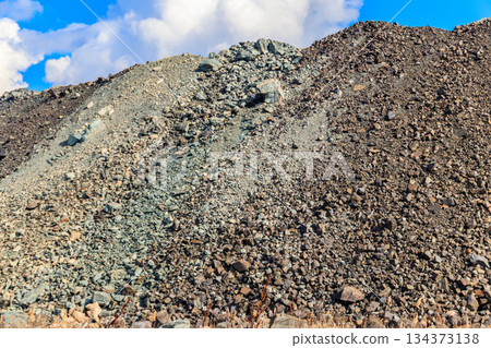View of slag heaps of iron ore quarry. Mining industry 134373138