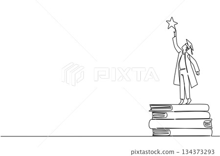 A motivational continuous line draw of a graduate man standing on stacked books and reaching for a star. Show determination, education, and success for National Higher Education Day in a conceptual 134373293