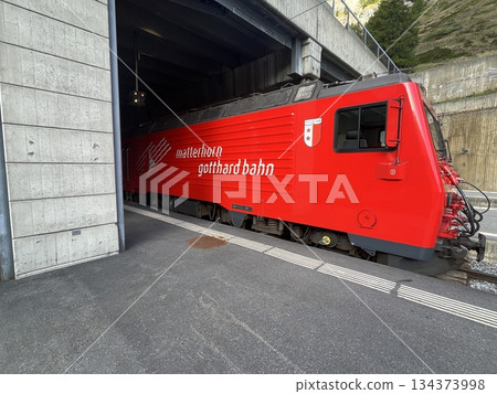 Red electric rack locomotive of the Swiss mountain railway Red electric rack locomotive of the Swiss mountain railway 134373998
