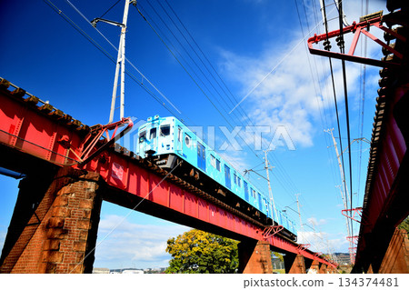 Auspicious train running over the Kinokawa Bridge (Nankai Electric Railway) [Wakayama City, Wakayama Prefecture] 134374481
