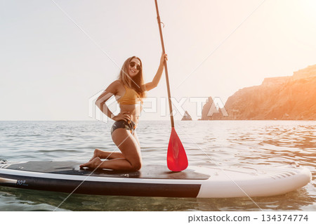 Woman Paddleboarding Ocean Beach Summer Woman Paddleboarding Ocean Beach Summer 134374774