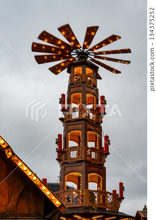 Wooden Christmas pyramid crepe and churros stand at Leuven winter market 134375252