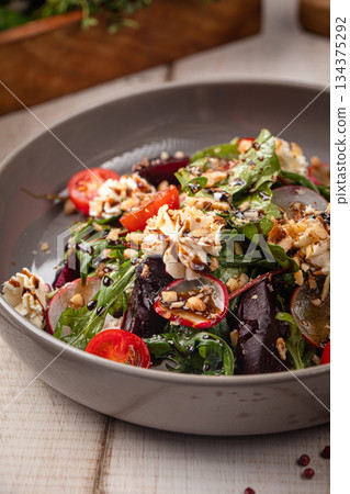 Fresh mixed salad with nuts and greens Fresh mixed salad with nuts and greens 134375292