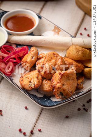 Grilled chicken kebab with dipping sauces Grilled chicken kebab with dipping sauces 134375302