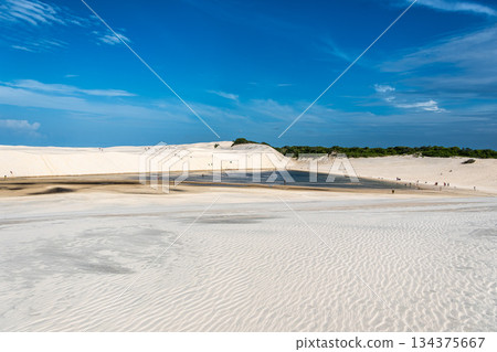 Dunes and lagoons of lagoa bonita, Lencois Maranhenses, Barreirinhas, Brazil. White sand dunes with pools of fresh water 134375667