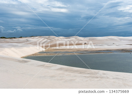 Dunes and lagoons of lagoa bonita, Lencois Maranhenses, Barreirinhas, Brazil. White sand dunes with pools of fresh water Dunes and lagoons of lagoa bonita, Lencois Maranhenses, Barreirinhas, Brazil. White sand dunes with pools of fresh water 134375669