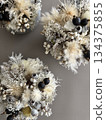 A winter-inspired arrangement of white flowers and dried flowers 134375855