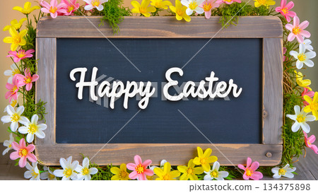 A frame with the inscription "Happy Easter" surrounded by bright spring flowers and greenery. A frame with the inscription "Happy Easter" surrounded by bright spring flowers and greenery. 134375898