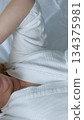 Young woman yawning in bed in morning at home 134375981
