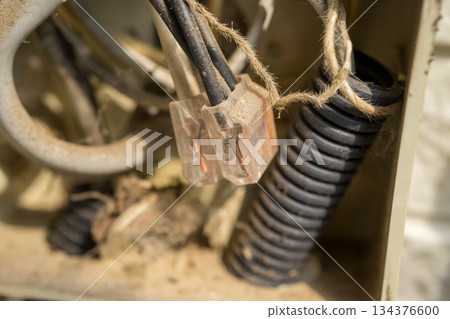 Junction box on the exterior wall of a house Junction box on the exterior wall of a house 134376600