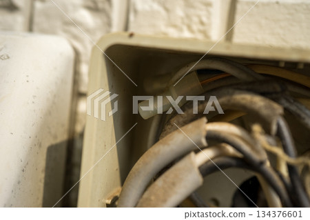 Junction box on the exterior wall of a house 134376601