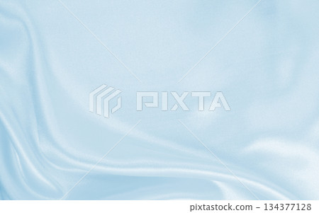 Smooth elegant blue silk or satin luxury cloth texture as abstract background. Luxurious background design Smooth elegant blue silk or satin luxury cloth texture as abstract background. Luxurious background design 134377128