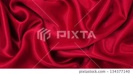 Smooth elegant red silk or satin luxury cloth texture as abstract background. Luxurious valentines day background design 134377140