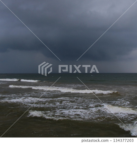 Dark clouds over a beach near Galle, Sri Lanka. 134377203