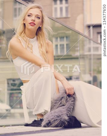 Woman wearing crop top and culottes Woman wearing crop top and culottes 134377650