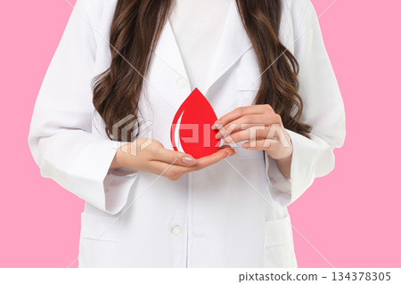 Blood donation event with a health pro and drop 134378305