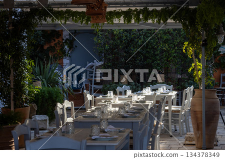 Tables ready for guests, Paxos, Greece 134378349