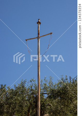 Rusted high metal cross in the nature, Greece Rusted high metal cross in the nature, Greece 134378354