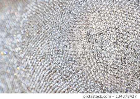 Closeup detail of luxury shiny synthetic diamonds neatly arranged for making jewelry accessories. Closeup detail of luxury shiny synthetic diamonds neatly arranged for making jewelry accessories. 134378427