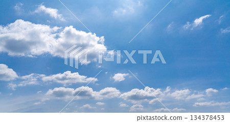 Clouds in the blue sky, Panoramic stage by light background during the summer day. Clouds in the blue sky, Panoramic stage by light background during the summer day. 134378453