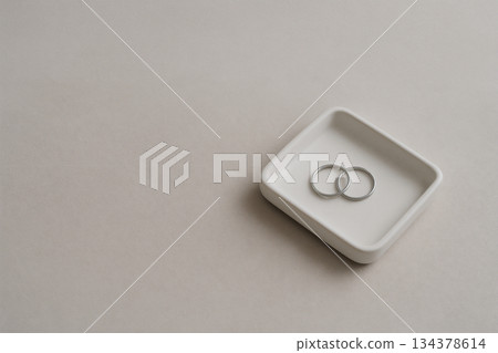Minimal styling of accessories arranged on a beige background 134378614