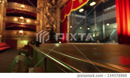 A vivid theater stage, with red curtains drawn back, showcases an empty space filled with anticipation. Soft lighting hints at the beauty of the performance to come, inviting the audience to enjoy. A vivid theater stage, with red curtains drawn back, showcases an empty space filled with anticipation. Soft lighting hints at the beauty of the performance to come, inviting the audience to enjoy. 134378980
