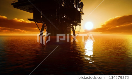 As the sun sets on the horizon, warm golden rays reflect on calm ocean waters. An oil rig stands tall, creating a striking silhouette against the colorful sky. As the sun sets on the horizon, warm golden rays reflect on calm ocean waters. An oil rig stands tall, creating a striking silhouette against the colorful sky. 134379273