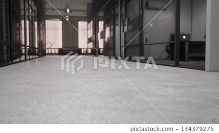 A sleek hallway connects various offices, showcasing large glass walls and polished concrete floors. Soft natural light filters in, enhancing the contemporary workspace feel. A sleek hallway connects various offices, showcasing large glass walls and polished concrete floors. Soft natural light filters in, enhancing the contemporary workspace feel. 134379276