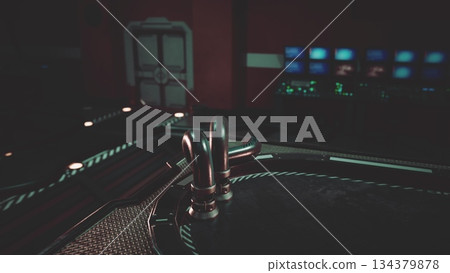 A high tech command center features glowing screens and intricate controls, creating an atmosphere of innovation. Metallic surfaces shine under soft lights, enhancing the futuristic vibe of the space. 134379878