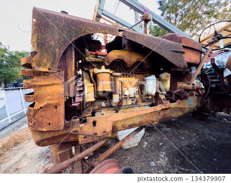 Old rusty vehicles in a vintage industrial setting Old rusty vehicles in a vintage industrial setting 134379907